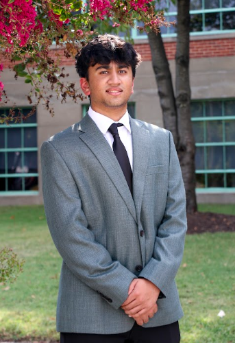 Prithvi Chakraborty in a gray suit